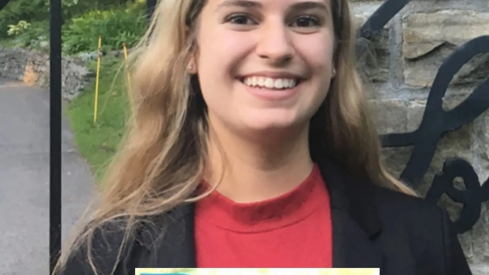 An image of Natalie Antonik in front of the US Embassy in Ottawa